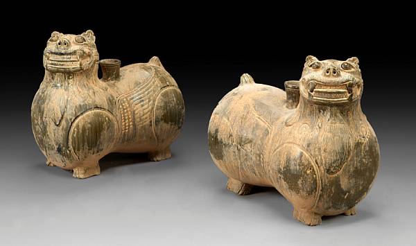 Appraisal: A pair of Chinese glazed earthenware vessels In the form