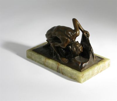 Appraisal: La Source' a bronze figure modelled resting and sipping water