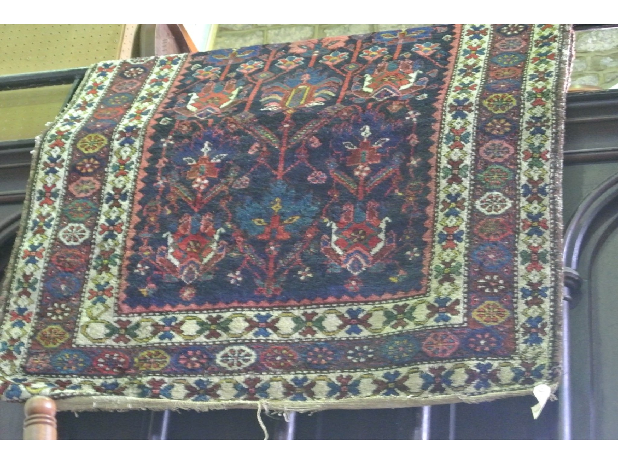 Appraisal: An Eastern wool carpet with black ground central medallion floral