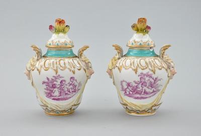 Appraisal: A Pair of Berlin Porcelain Covered Jars Each elaborately cast