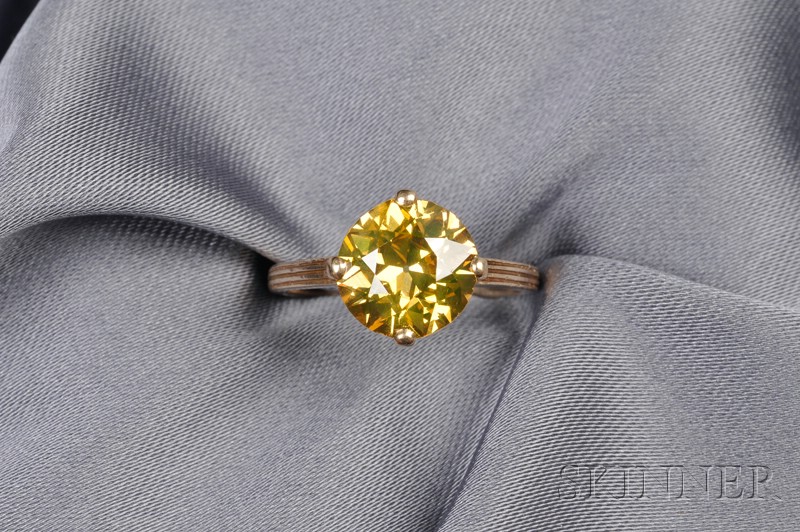 Appraisal: Colored Diamond Solitaire prong-set with a light cognac brown old