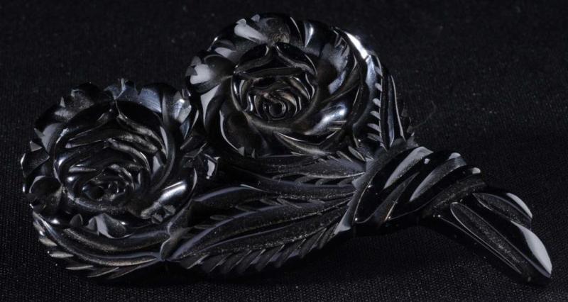 Appraisal: Bakelite Deeply Carved Black Flower Pin Condition Excellent Size x