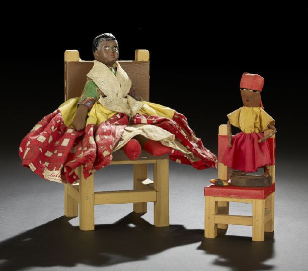 Appraisal: Two Haitian Chair Dolls the native fabric-clothed dolls perched on