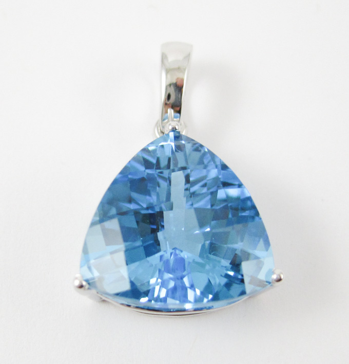 Appraisal: BLUE TOPAZ AND FOURTEEN KARAT WHITE GOLD PENDANT set with