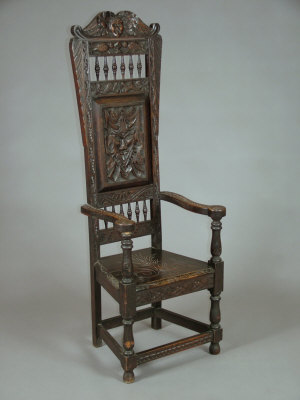 Appraisal: A carved oak high back open armchair late th century