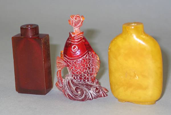 Appraisal: Three amber snuff bottles th Century The first of opaque