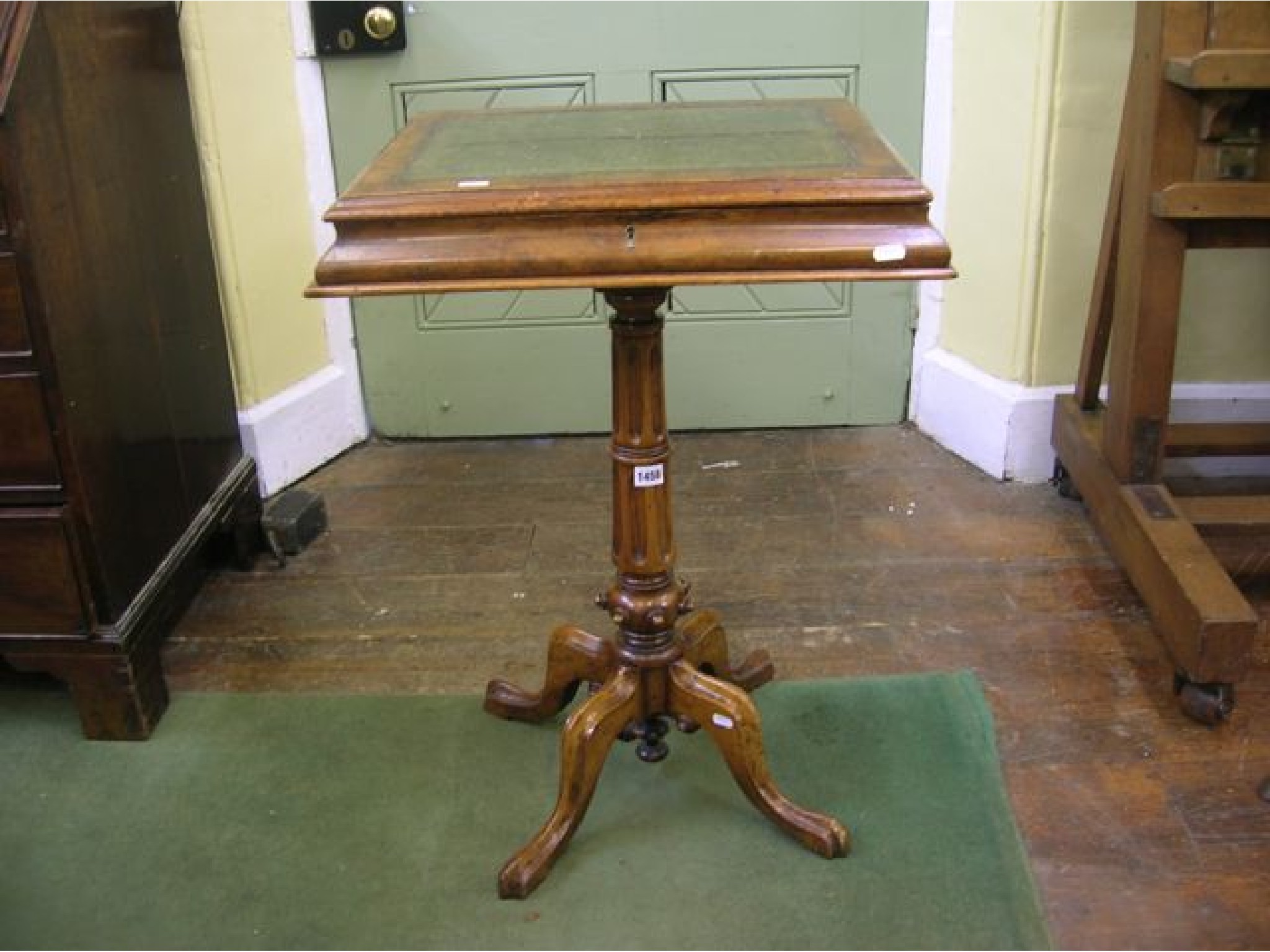 Appraisal: A Victorian walnut and figured walnut pedestal writing table the