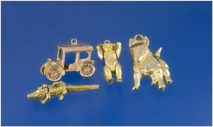 Appraisal: Carat Gold Charms in total Car Teddy Bear Crocodile Pit