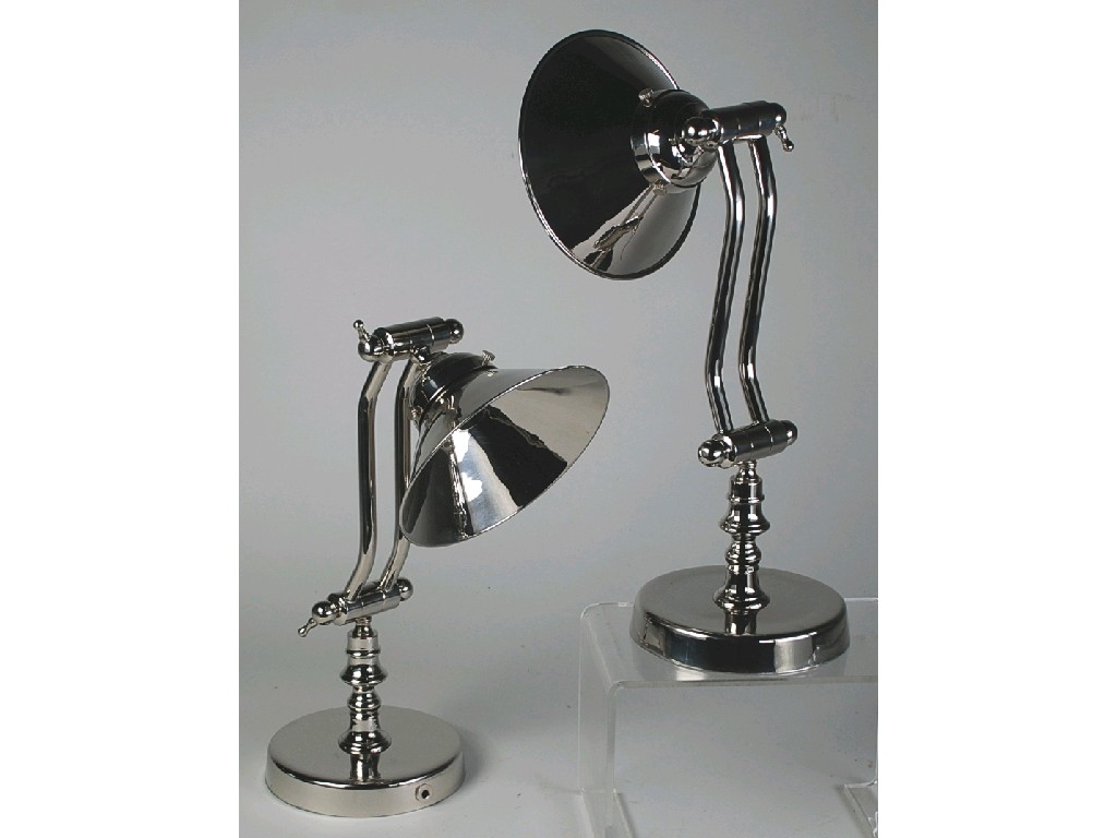 Appraisal: PAIR OF CHROME PLATED ELECTRIC ADJUSTABLE DESK LAMPS with shades