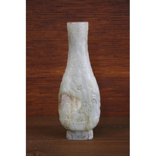 Appraisal: Chinese archaistic rustic green jade vase carved in low relief