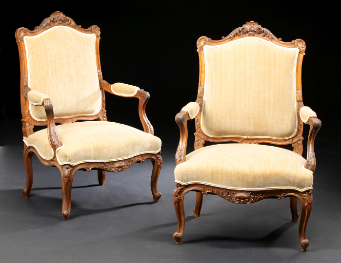 Appraisal: Pair of Provincial Louis XV-Style Fruitwood Armchairs late th century