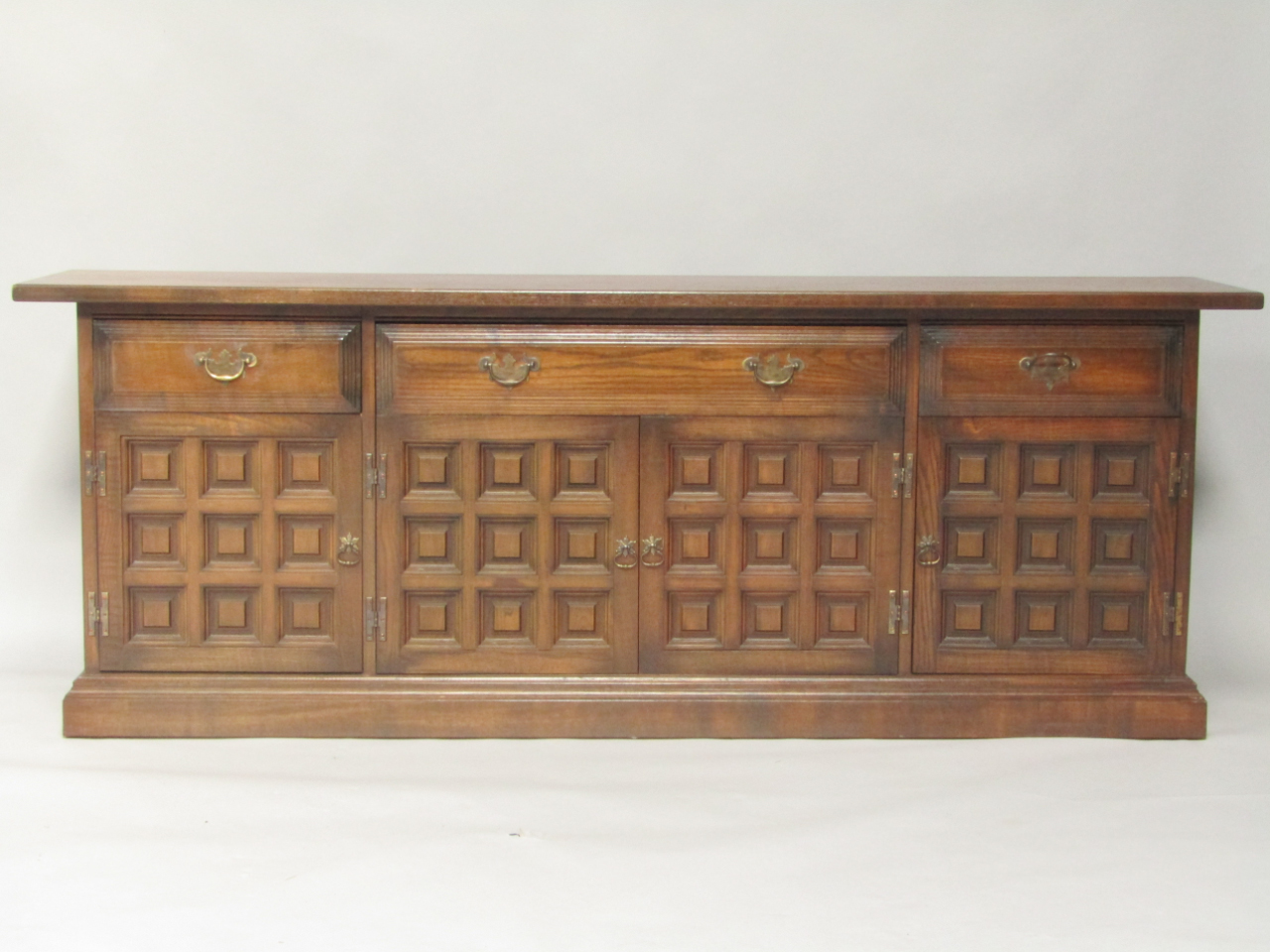 Appraisal: A Younger oak sideboard with one long and two short