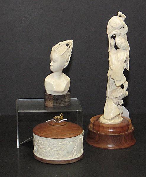 Appraisal: Three pieces of African carved ivory th century Comprising a