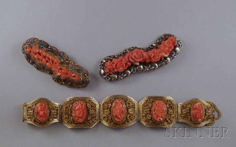 Appraisal: Two Silver-Framed Carved Coral Brooches and a Gilt-Silver and Carved