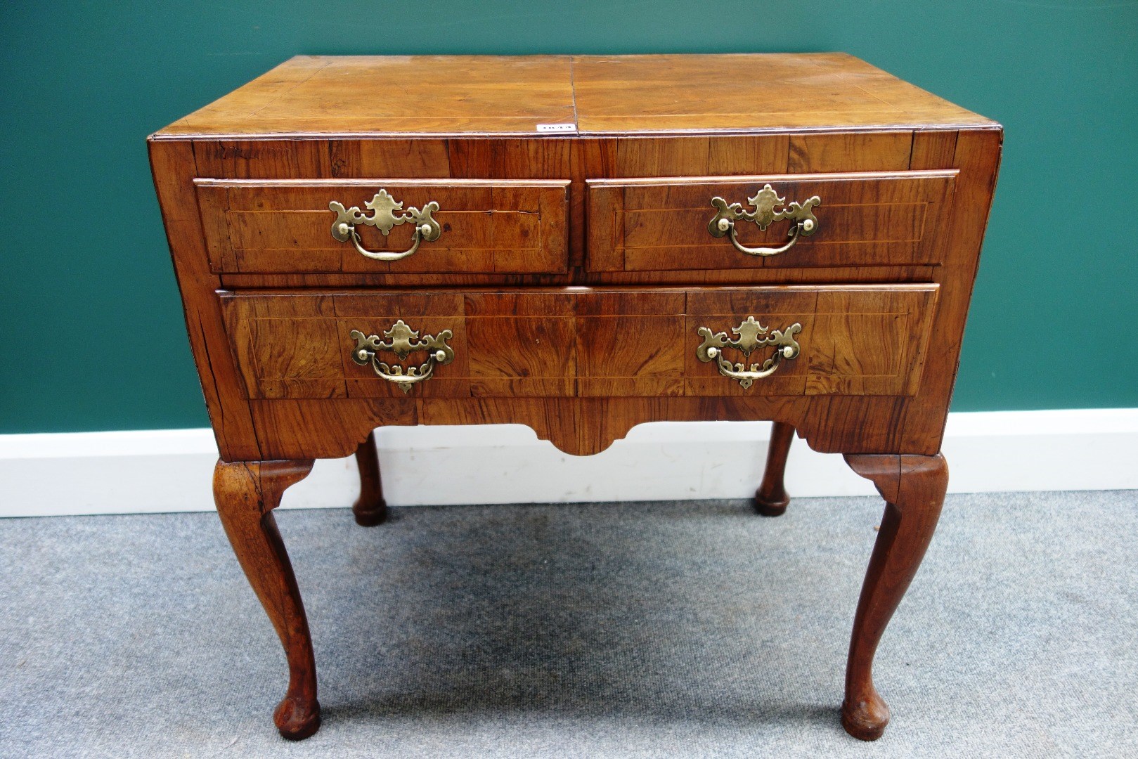 Appraisal: An th century figured walnut lowboy with two short over