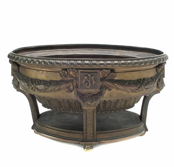 Appraisal: A Louis XVI style patinated bronze centerpiece height in width