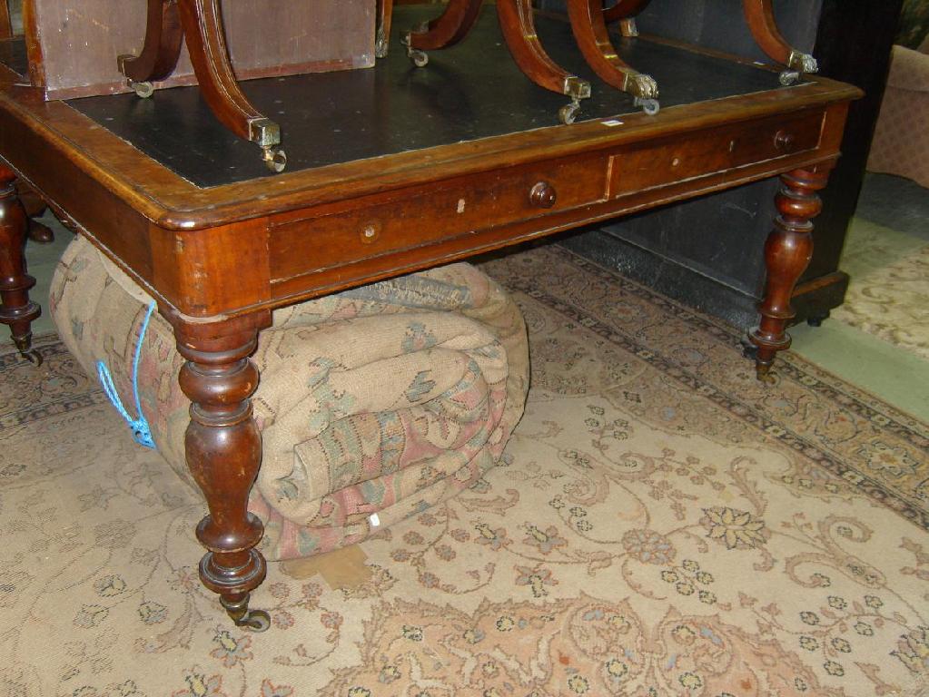 Appraisal: A Victorian mahogany partners table with inset leather top with