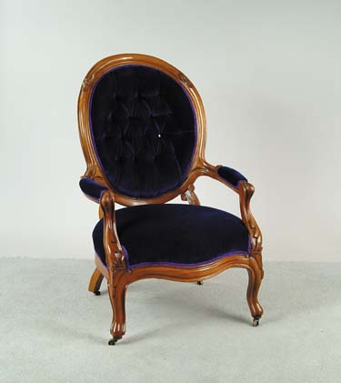 Appraisal: VICTORIAN WALNUT GENTLEMAN S CHAIR Finger carved with replaced blue