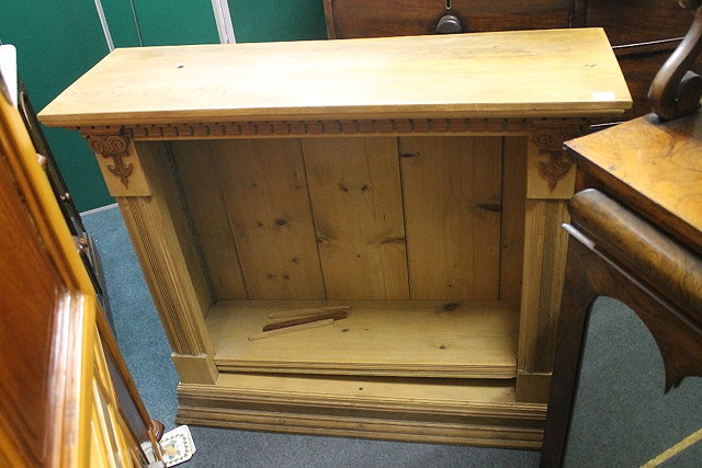 Appraisal: A PINE OPEN BOOKCASE with dentil cornice and reeded column