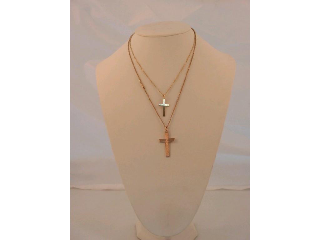 Appraisal: Two ct gold crucifix on chains light