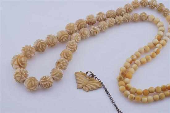 Appraisal: A CARVED IVORY NECKLACE WITH ANOTHER IVORY AND NEPHRITE PENDANT