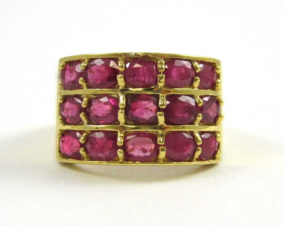 Appraisal: RUBY AND TEN KARAT YELLOW GOLD RING set with oval-cut