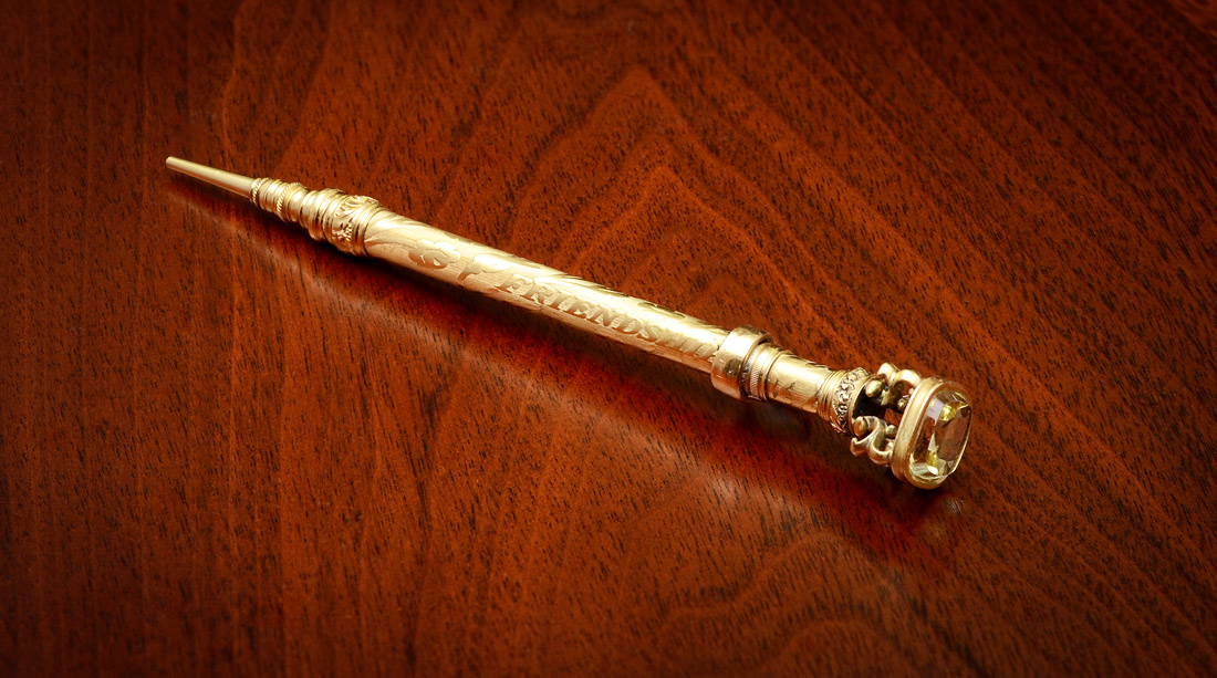 Appraisal: VICTORIAN GOLD PENCIL WITH CITRINE Ornately embossed K yellow gold