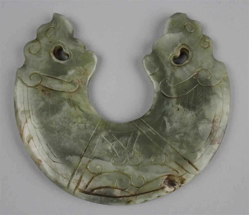 Appraisal: CHINESE PARTIALLY CALCIFIED JADE CARVING of semicircular form the terminals