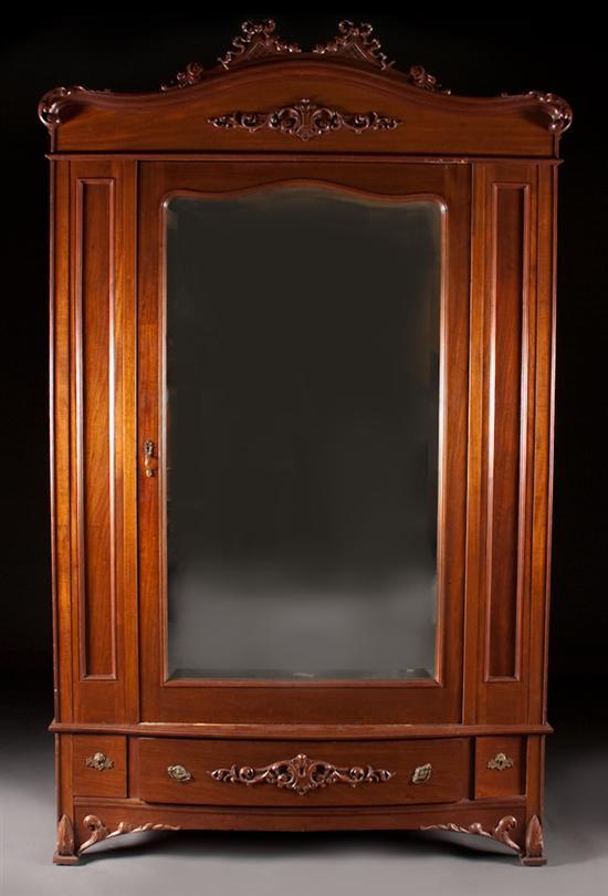 Appraisal: Louis XV style carved walnut beveled mirrored panel wardrobe late