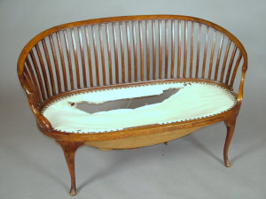 Appraisal: A mahogany spar back twin settee early th century of