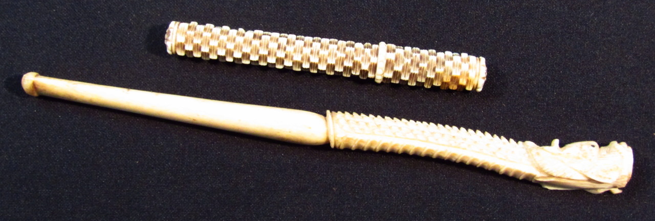 Appraisal: A thC carved ivory needle case with screw top the