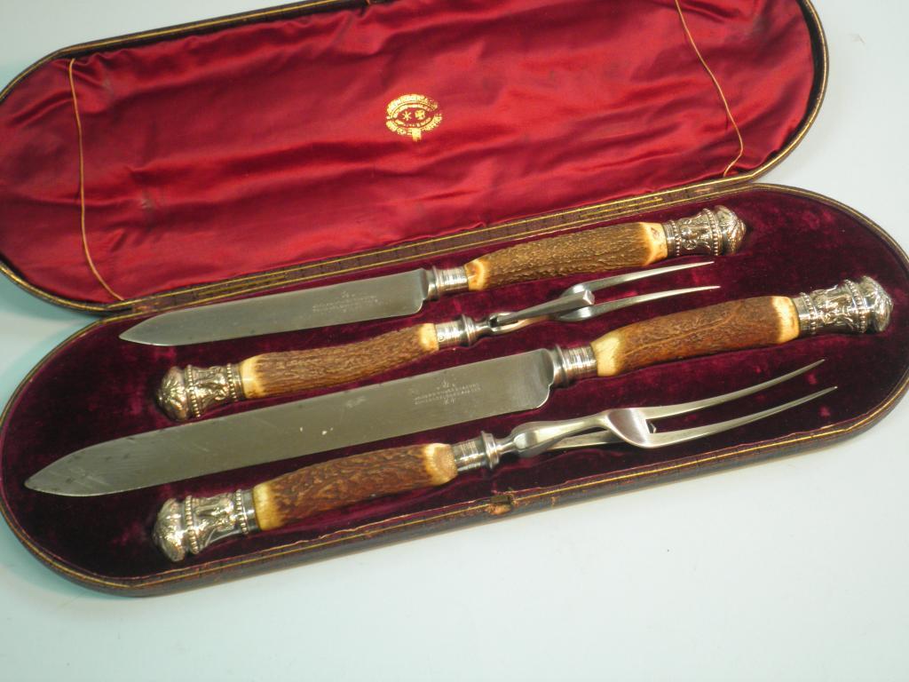 Appraisal: A Victorian antler and silver mounted carving set comprising of