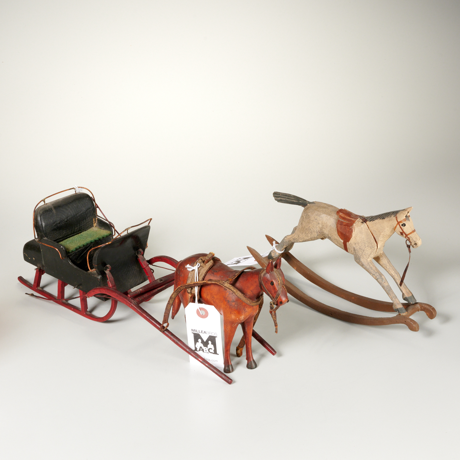 Appraisal: ANTIQUE HORSE DRAWN CARRIAGE ROCKING HORSE TOYS Likely th c