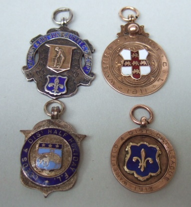 Appraisal: Two ct gold and enameled fob medallions dated and a