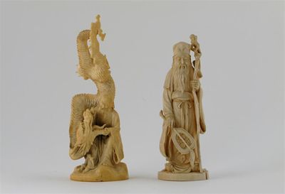 Appraisal: Two Japanese ivory carvings one depicting a sage holding his