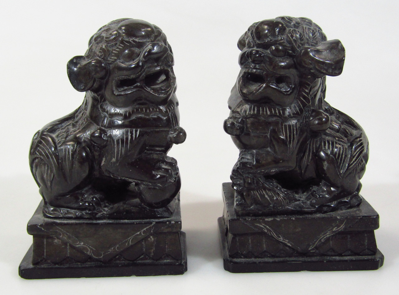 Appraisal: A pair of polished Chinese stone Dogs of Fo each