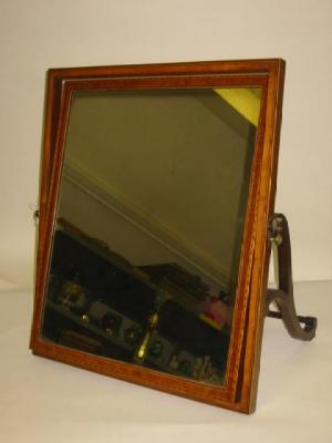 Appraisal: A SATINWOOD TOILET MIRROR of oblong form crossbanded with stringing