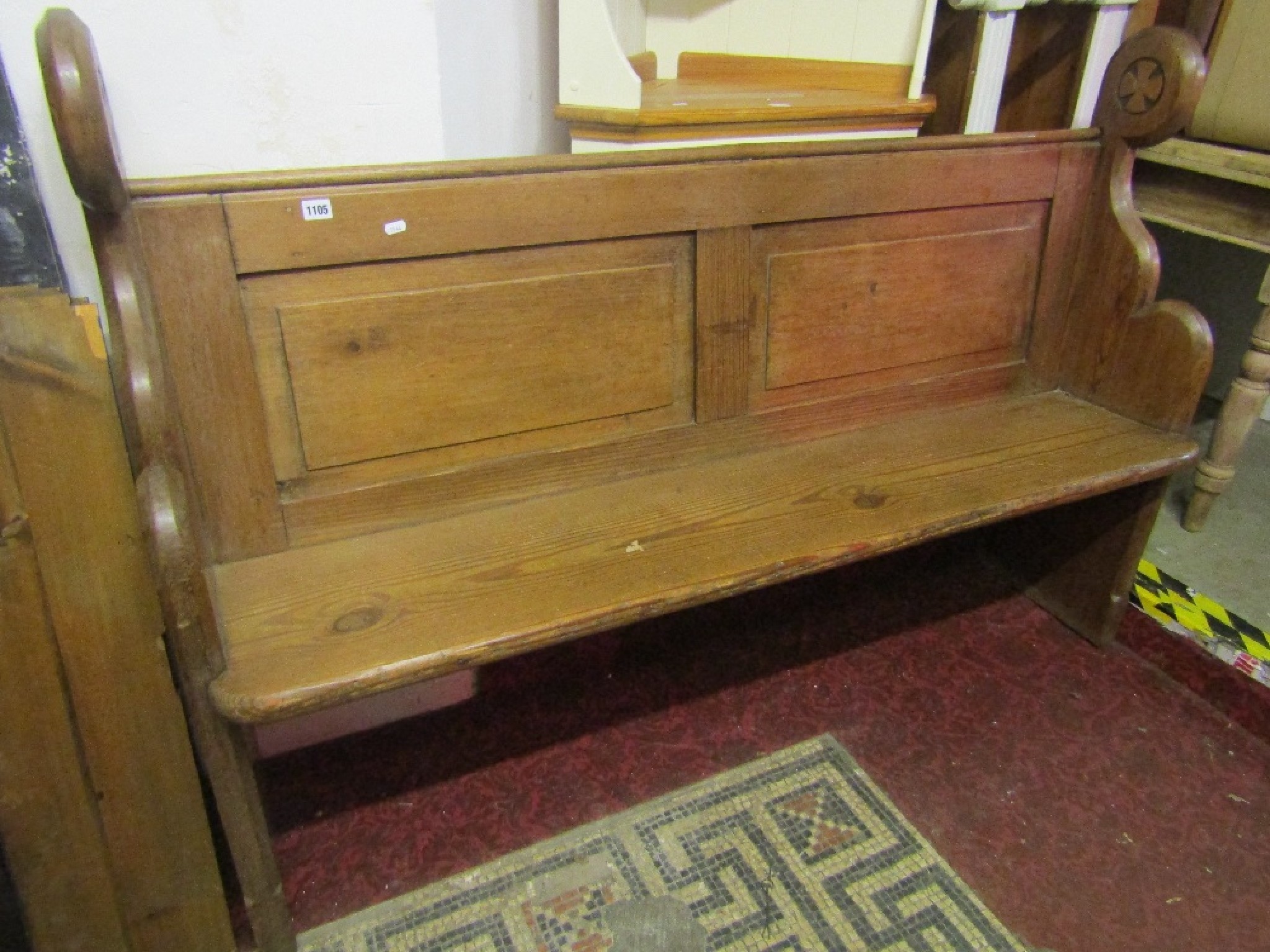 Appraisal: A reclaimed Victorian pitch pine church pew with shaped and