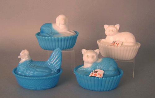 Appraisal: Four blue and white milk glass candy dishes with kittens