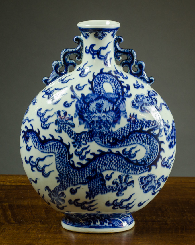 Appraisal: CHINESE QING BLUE AND WHITE MOON FLASK with footed base