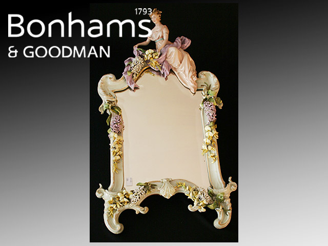 Appraisal: A porcelain framed mirror in Dresden taste with applied figural