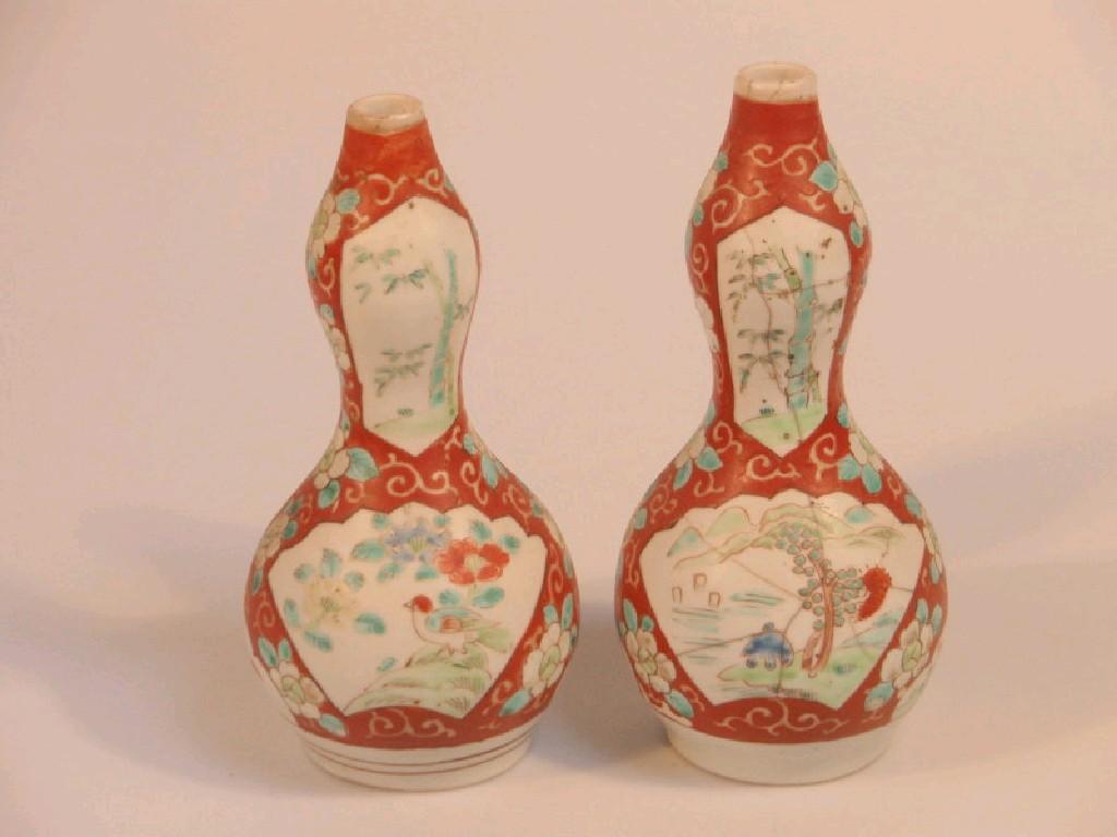 Appraisal: Two similar Imari double gourd vases painted with birds and