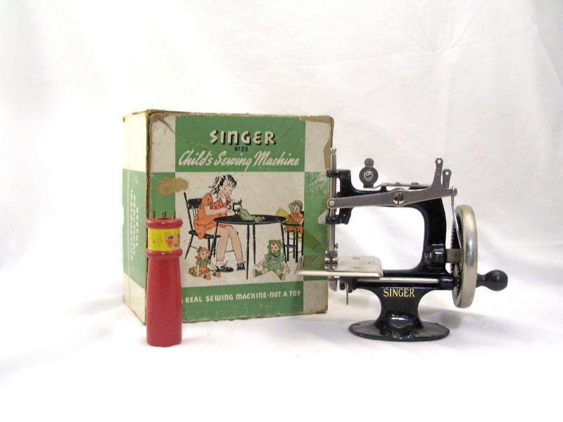 Appraisal: Child's Singer Sewing Machine Model with original box Measures high