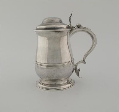 Appraisal: A George II baluster tankard with a spreading foot a