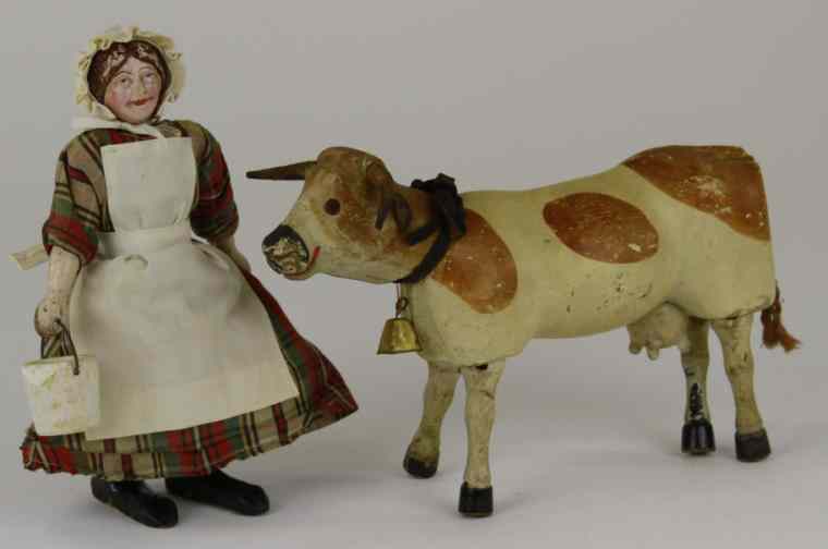 Appraisal: SCHOENHUT MILKMAID AND COW Hand painted wood milk maid wears