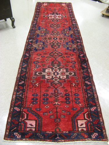 Appraisal: PERSIAN HAMADAN RUNNER hand knotted in a stylized floral and