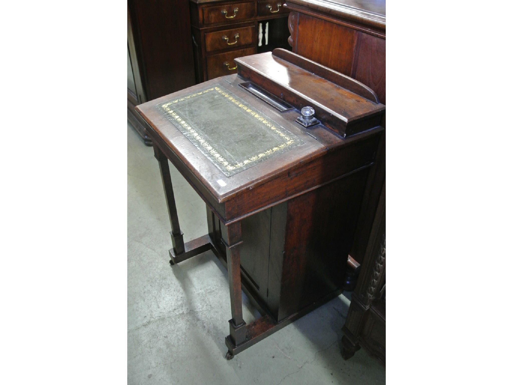 Appraisal: A late Victorian mahogany davenport with shallow hinged box stationery