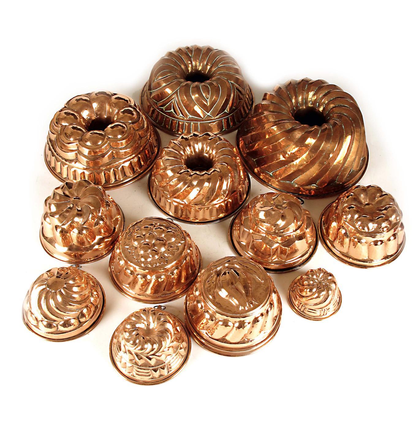 Appraisal: A small collection of thirteen copper jelly moulds