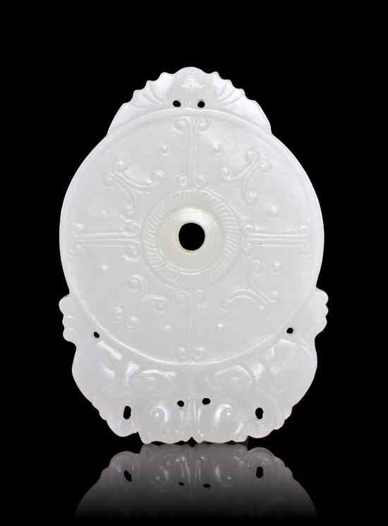 Appraisal: A White Jade Bi of circular form with geometric decoration