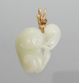 Appraisal: A Carved White Jade Pendant with Gold Bail Carved in